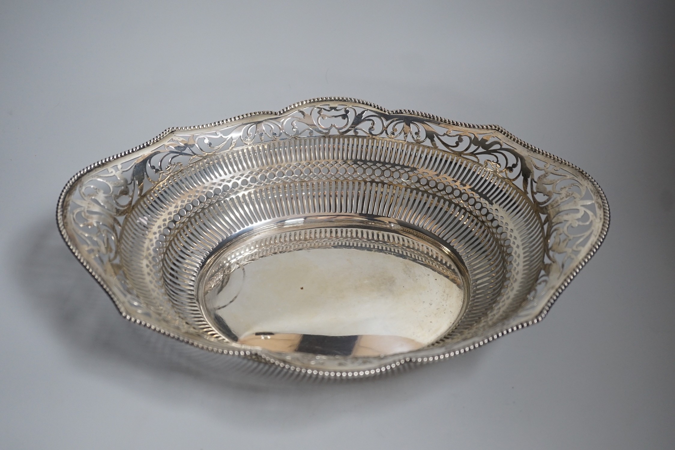 An early 20th century Dutch pierced white metal cake basket, 33.7cm, 16.5oz.